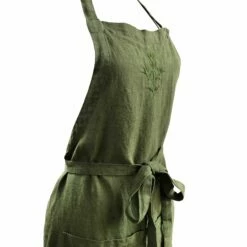 Dark Green Embroidered Linen Apron 5 Dark Green Embroidered Linen Apron -Penguin Random House Sales Store Greenaproncup140321v1